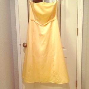 Pale yellow bridesmaid dress.