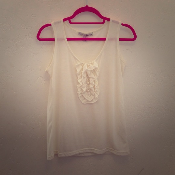 Cream tank top with detailing down the bust