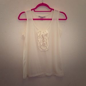 Cream tank top with detailing down the bust