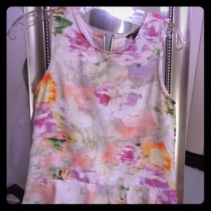 Floral peplum sleeveless top