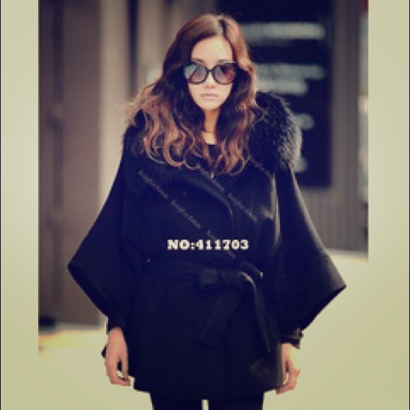 Black fur hooded poncho. Brand new. Size M.