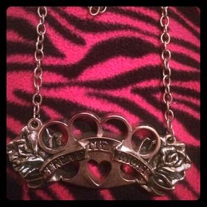 Brass knuckle necklace.