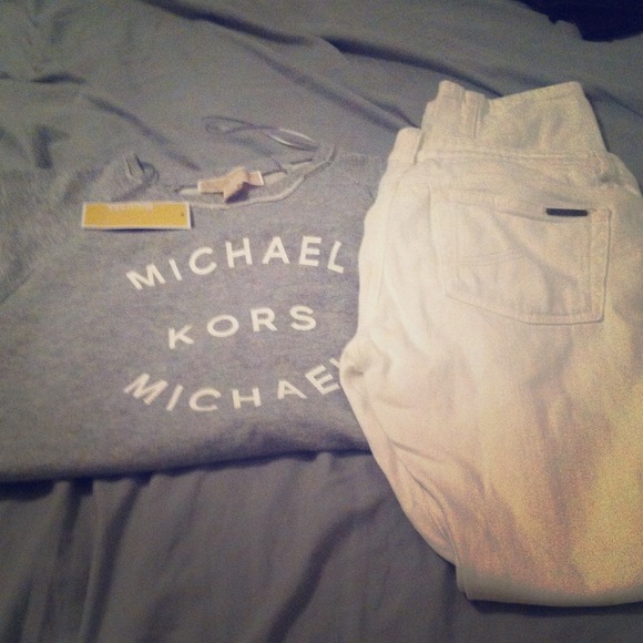 Michael Kors sweatshirt and white jeans