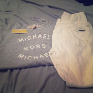 Michael Kors sweatshirt and white jeans