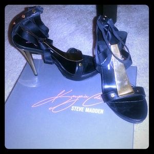 Gold and black Keyshia Cole shoes