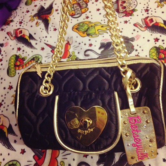 Betsey Johnson small barrel shoulder bag.