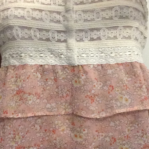 White laced top with layers of pink fabric