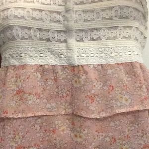 White laced top with layers of pink fabric