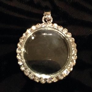 Silver toned floating charm locket