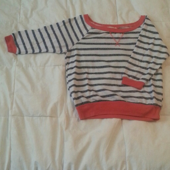 Striped orange sweater.