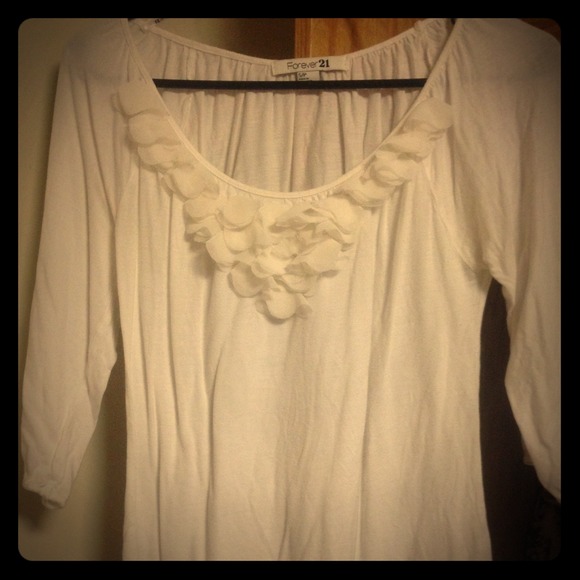 Quarter sleeve top with petal neckline.