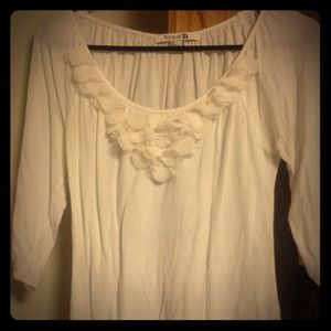 Quarter sleeve top with petal neckline.