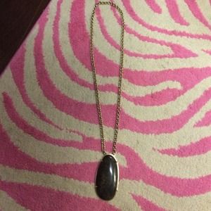 Gold chain necklace with large stone