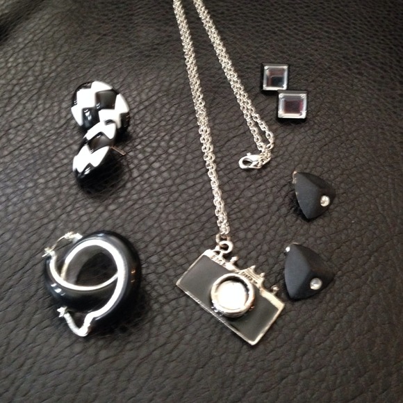 Group of black and white earrings and necklace