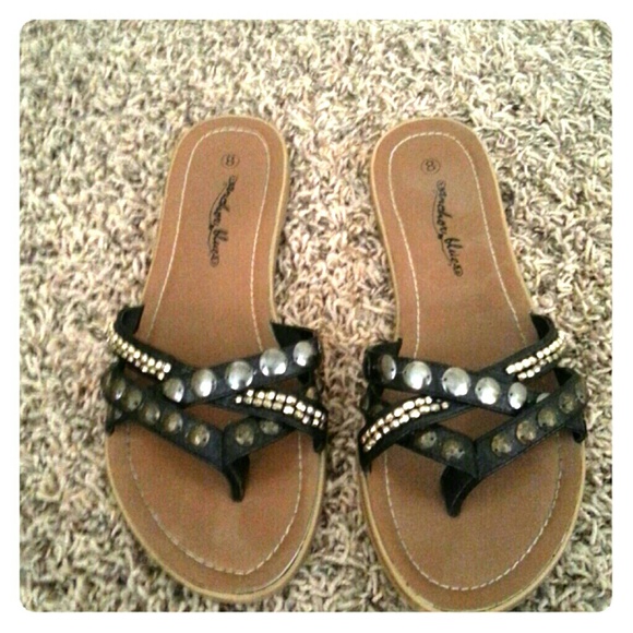 Black with bronzed detail flip flops