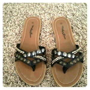 Black with bronzed detail flip flops
