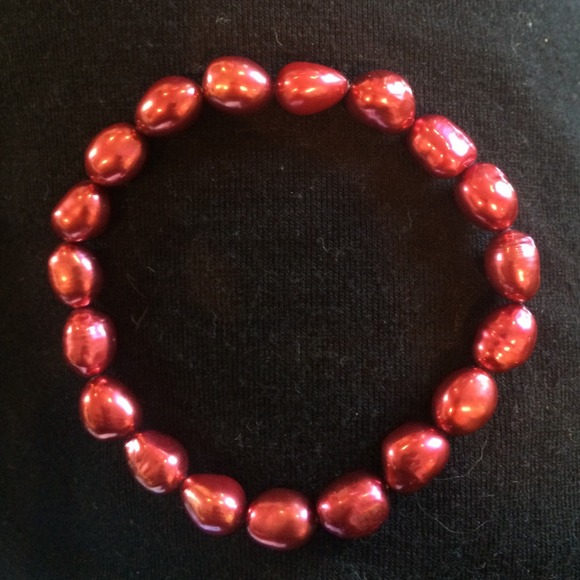 Red pearl bracelet.