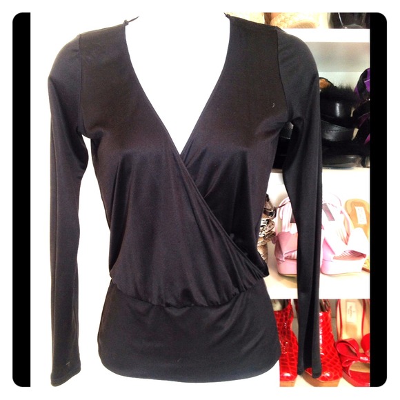 100% silk sexy black top with V neck front & back.