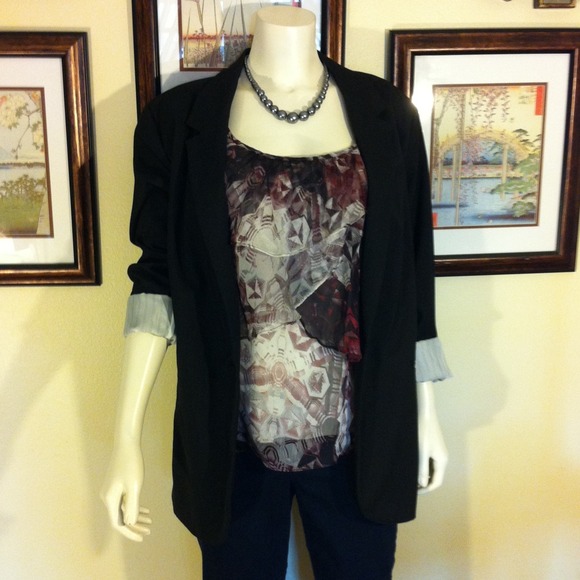 Modern long black blazer.