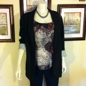 Modern long black blazer.