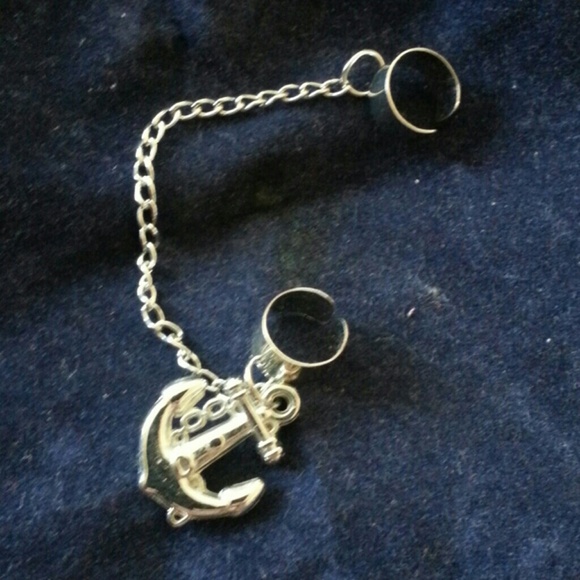 Cuff earring with hanging charm.