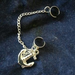 Cuff earring with hanging charm.