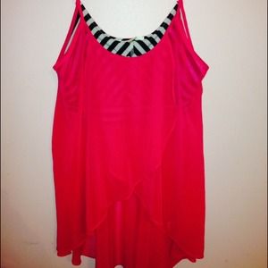 Pink tank top that shows some stomach. Very cute!