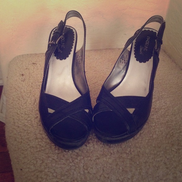 Sweet and sassy black peep toe heals.