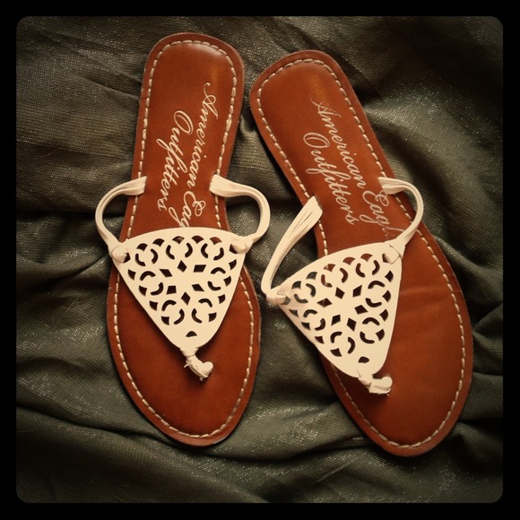 White leather flip flops