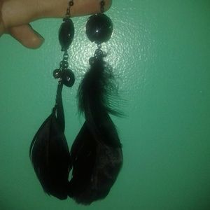 Black feathers and stone .