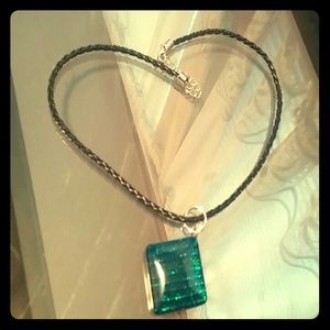 Blue square shaped charm on bead cord