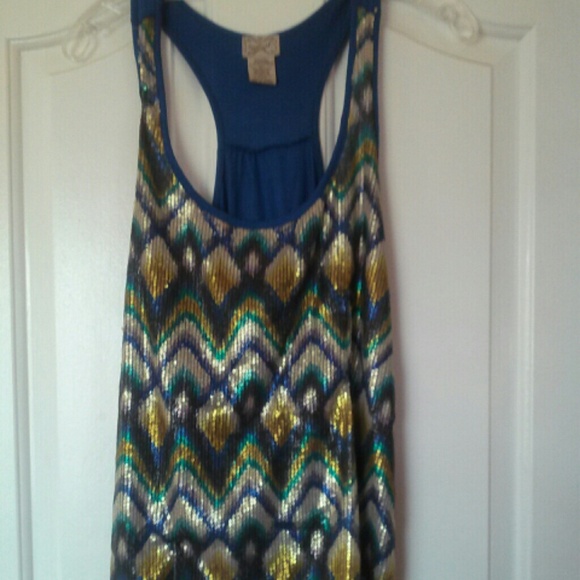Blue top with gold, silver, and blue sequins.