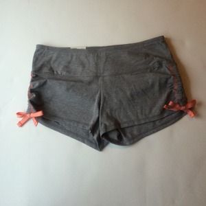 Cloth yoga shorts. Grey with orange side bows.