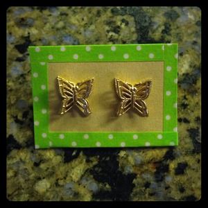 Gold butterfly stud earrings.