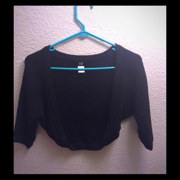 Short black cardigan with silver sparkles.