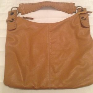 Tan faux leather purse with bronze accents