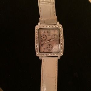 White watch with a little pink in it