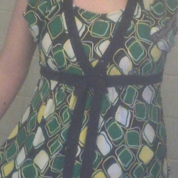 A brown dress with green, yellow, an white squares