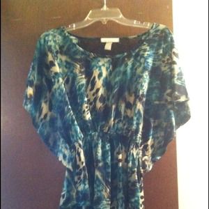 Winged sleeved green, tan and black shirt