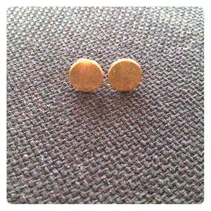Gold plated flat pad ear studs.