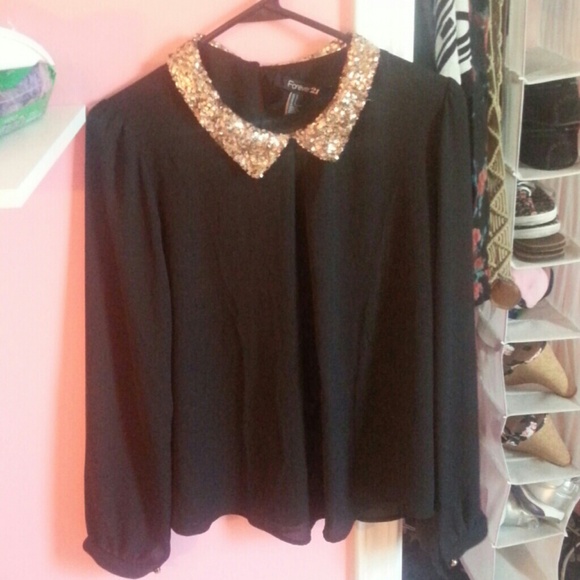 Black top with gold sequin collar. Long sleeve