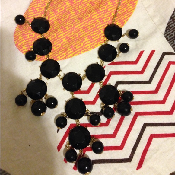 Black stone with gold necklace