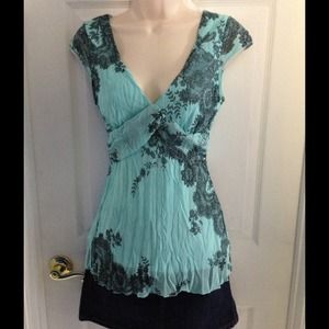 Light teal blue top.