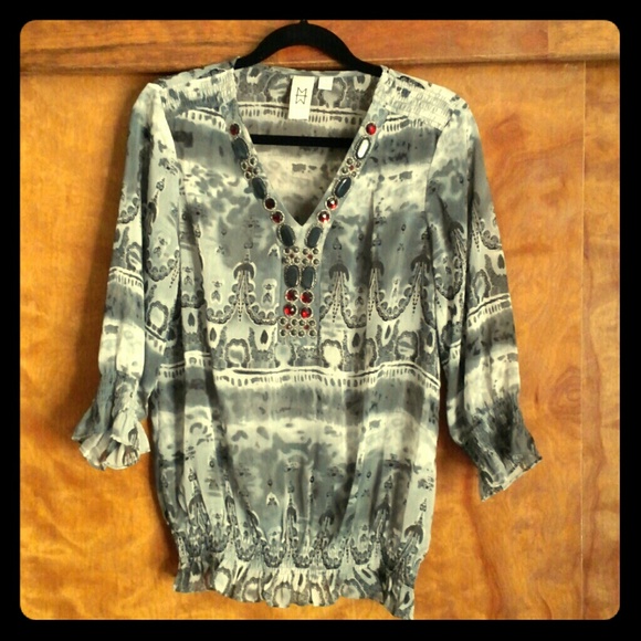 A gorgeous sheer v neck top