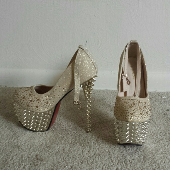 A pair of gold on gold studded platforms. - Picture 1 of 1