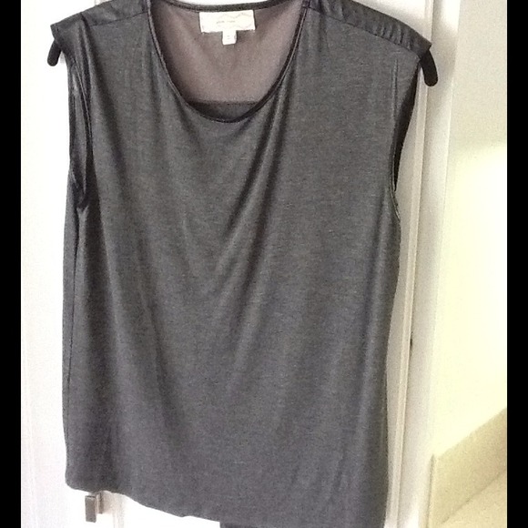 Grey top with black leather details and open back