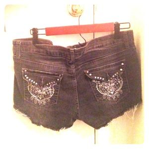 Distressed studded black denim shorts