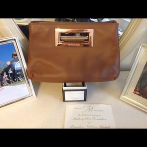 Authentic Michael Kors brown leather clutch