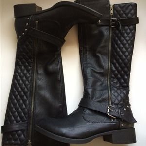 Knee high motorcycle boots.