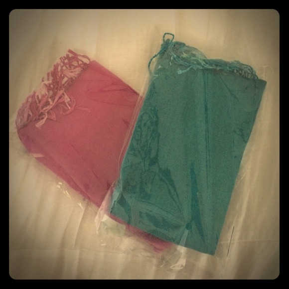 2 brand new pashminas. 1 fuchsia, 1 teal.